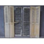 Two pairs of vintage distressed painted louvred French doors and a similar pair. H.164 W.56cm (
