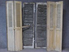 Two pairs of vintage distressed painted louvred French doors and a similar pair. H.164 W.56cm (