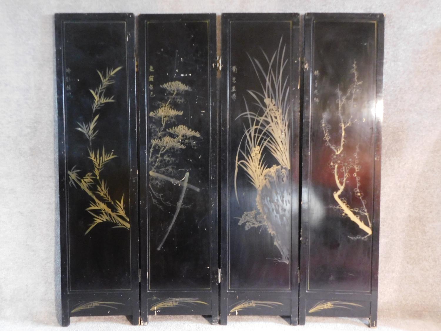 A Japanese mother of pearl and bone inlaid black lacquered three fold and four panel screen. H.183 - Image 8 of 15