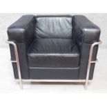 A Le Corbusier LC2 style armchair in faux black leather upholstery. H.71 W.92 D.80cm