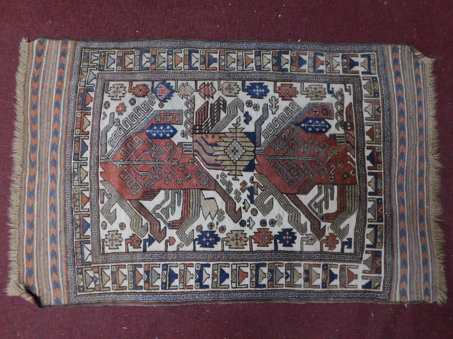 An Anatolian rug with ornate geometric design on ivory ground surrounded by multi geometric