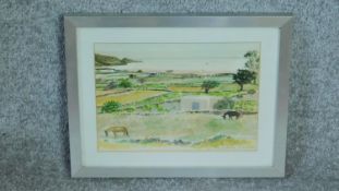 A framed and glazed watercolour of Santorini landscape by a British painter Anne Usborne. Signed and