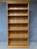 A contemporary pine open bookcase on plinth base. H.198 W.99 D.32cm