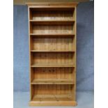 A contemporary pine open bookcase on plinth base. H.198 W.99 D.32cm