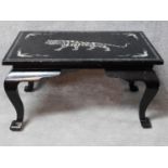 An Eastern black lacquered with mother of pearl inlay coffee table on cabriole supports. H.48 L.91