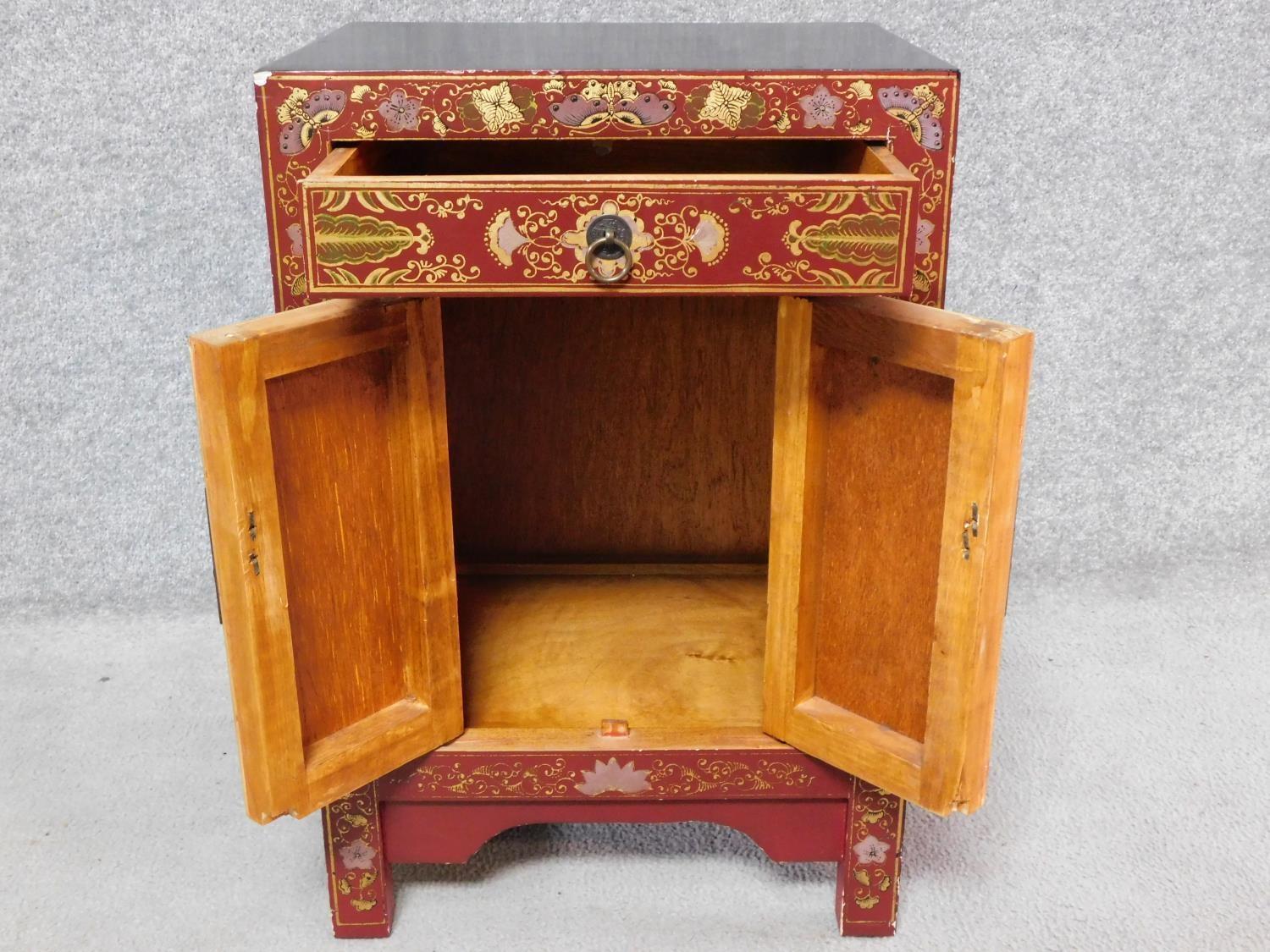 A Chinese red lacquered side cabinet with allover butterfly decoration. H.60 W.40 D.32cm - Image 3 of 6