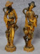 A pair of Chinese style moulded figures. H.49cm