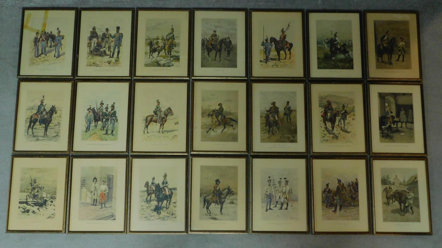 A framed and glazed collection of twenty one military prints. 44x34cm