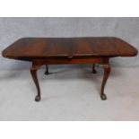 A late 19th century mahogany extending dining table with extra leaf on cabriole supports. H.78 W.182