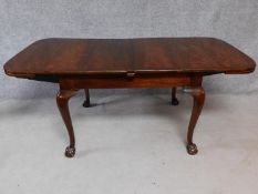 A late 19th century mahogany extending dining table with extra leaf on cabriole supports. H.78 W.182