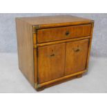 An American walnut brass bound side cabinet with inset military style handles. H.62 W.62 D.42cm