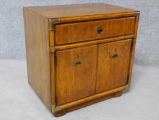 An American walnut brass bound side cabinet with inset military style handles. H.62 W.62 D.42cm