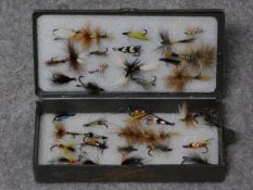 A collection of vintage fishing flies in portable case. 19x9cm (box size)