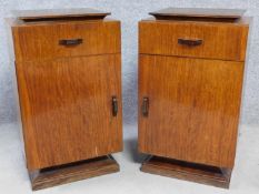 A pair of vintage Continental Art Deco style rosewood teak and ebonised bedside cabinets with frieze