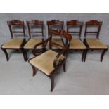 A set of six late 19th century mahogany Regency style dining chairs with swag carved back rails