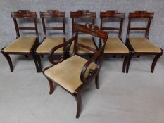 A set of six late 19th century mahogany Regency style dining chairs with swag carved back rails