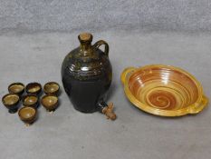 A collection of Mid Century Cooper Pottery studio glazed stoneware pieces including a tapped flagon,