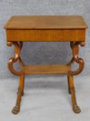 A 19th century Continental ebony line inlaid lamp table on shaped cabriole lion paw supports. H.69