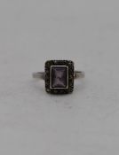 A vintage silver amethyst and marcasite cluster ring, stamped 925. Ring size L1/2.