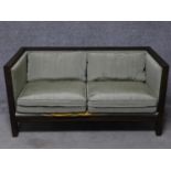 A contemporary framed two seater settee. H.71 W.142 D.71cm