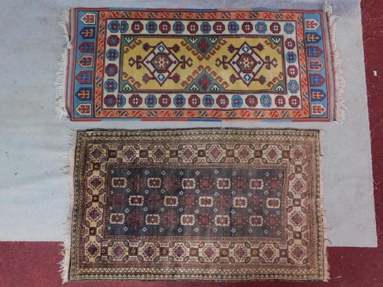An antique Baluch rug, Persia, c.1900, c. 140 x 90 cm A modern Turkish rug, 20th century, 178x76cm