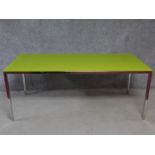 A contemporary glass topped dining table on chrome frame and supports. H.72 W.180 D.80cm