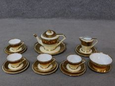 An Art Deco Noritake gold plate porcelain tea set. Makers mark to base.