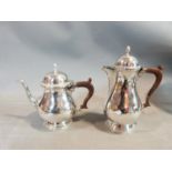 A Georgian style silver plated Barker & Ellis coffee and tea pot along with a cased set of Yeomans
