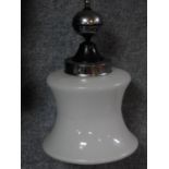 An Art Deco milk glass and chrome hanging lampshade with geometric design chain. H.148cm (with