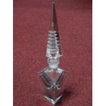An Art Deco crystal perfume bottle with illusion cut pagoda stopper. H.26cm