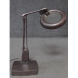 A vintage Dazor magnifier desk lamp with copper metallic finish. H.60cm