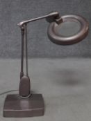 A vintage Dazor magnifier desk lamp with copper metallic finish. H.60cm