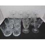 A collection of cut glasses, to include four champagne coupes, six whiskey tumblers and four crystal