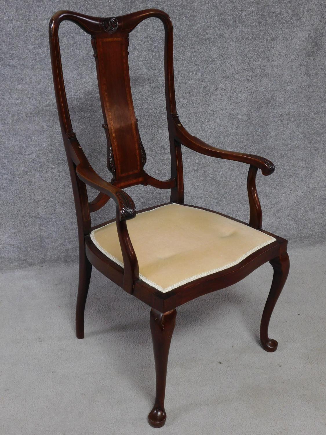 An Edwardian mahogany and satinwood inlaid armchair on cabriole supports. H.105cm