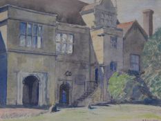 A framed and glazed watercolour depicting an old manor house. Indistinctly signed. 44x52cm
