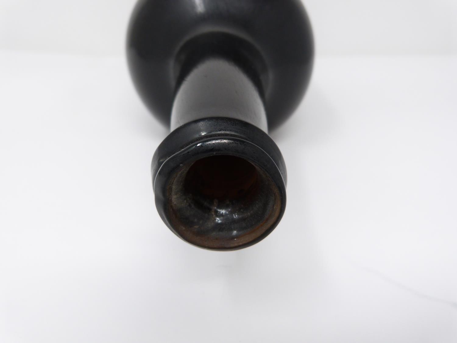 An 18th century All Souls College common room, Oxford sealed brown glass wine bottle. H25.5cm. - Image 5 of 5