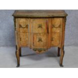 A 19th century Continental walnut two drawer commode with ormolu edges and mounts and allover