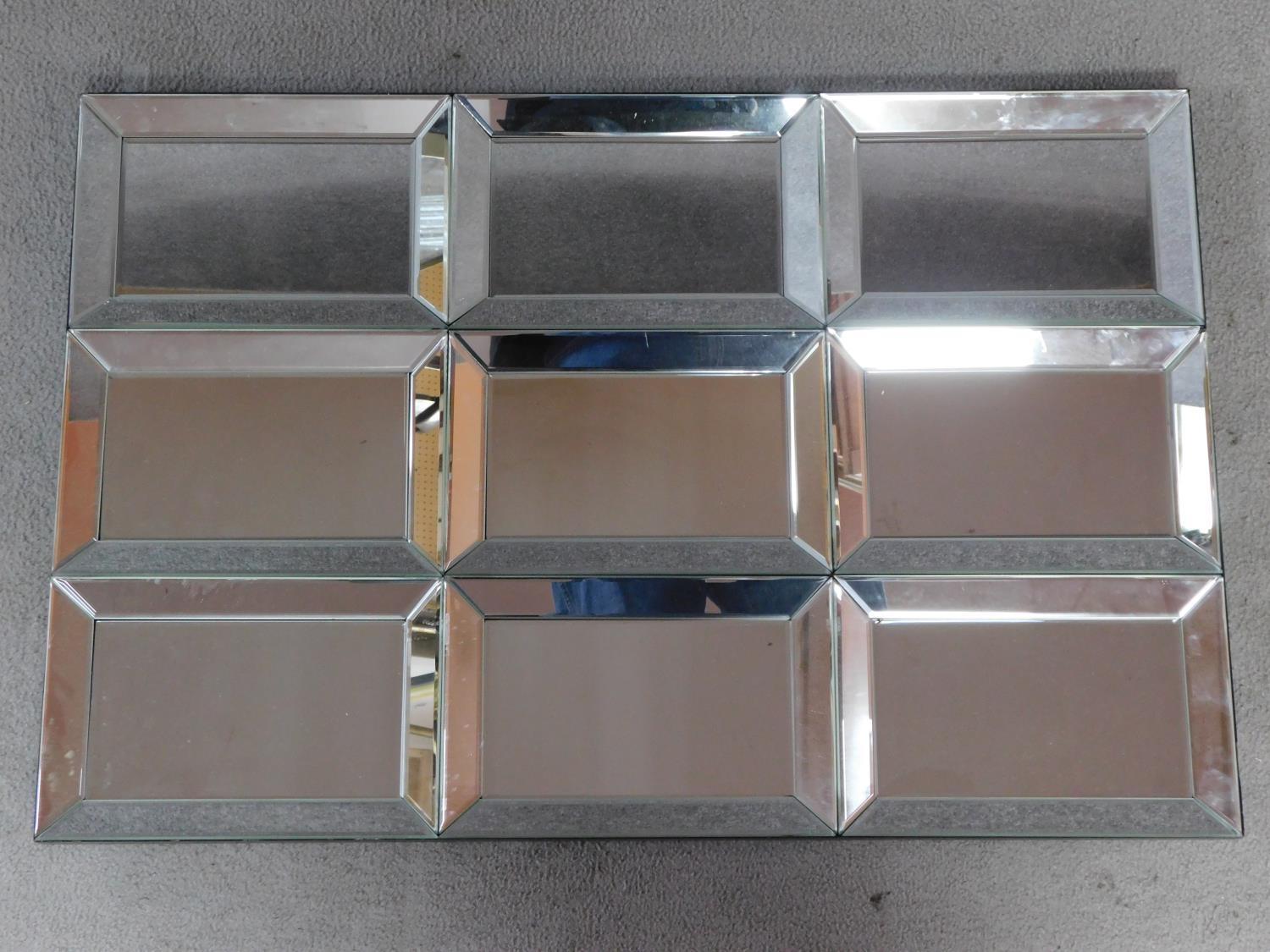 A wall mirror with nine glazed frame sections. 90x60cm