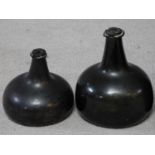 Two 17th to early 18th century green glass onion shaped wine bottles.