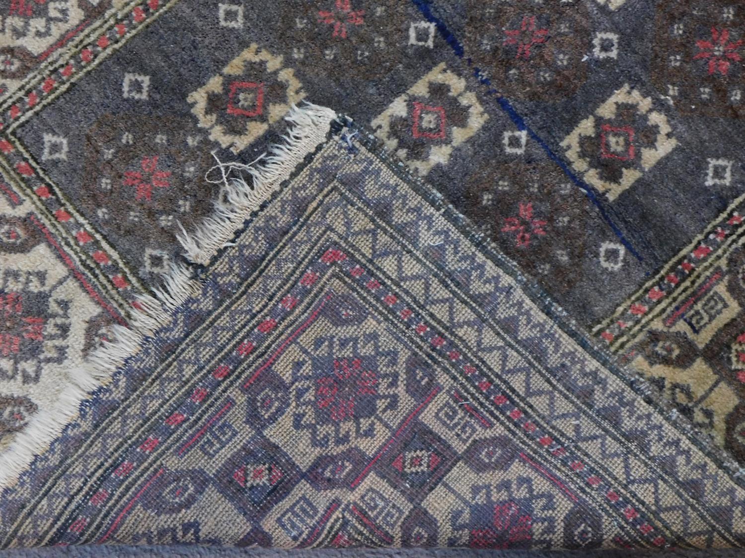 An antique Baluch rug, Persia, c.1900, c. 140 x 90 cm A modern Turkish rug, 20th century, 178x76cm - Image 7 of 7