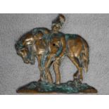 An antique bronze relief wall plaque of a soldier leaning on his horse. Indistinctly signed Jacques.