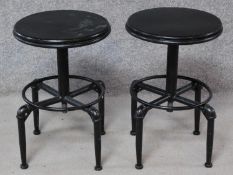 A pair of industrial style adjustable metal stools. H.87cm (full height).