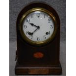 An F S antique mahogany and satinwood inlaid mantle clock, with brass dedication panel, brass