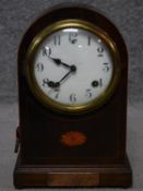 An F S antique mahogany and satinwood inlaid mantle clock, with brass dedication panel, brass