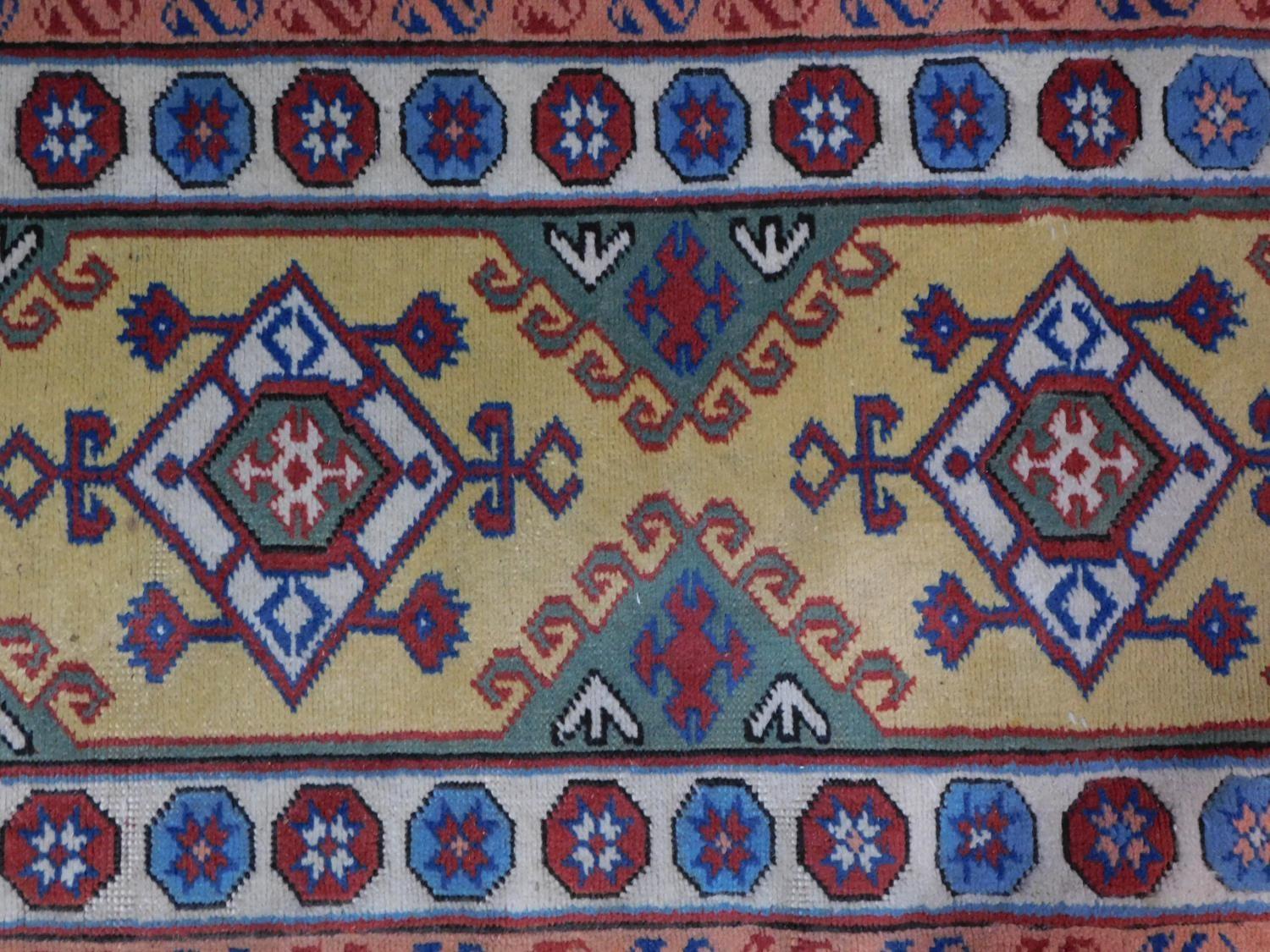 An antique Baluch rug, Persia, c.1900, c. 140 x 90 cm A modern Turkish rug, 20th century, 178x76cm - Image 2 of 7