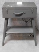 A military style bedside table from an old case wired as a charging station. H.80 L.60 W.40cm