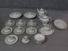 A Royal Doulton White Nile pattern part dinner service, including coffee pot, tea pot and coffee