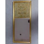 A gilt framed mirror with antique embroidery panel with stylised floral and foliate design. 108x47cm