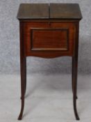 An Edwardian mahogany sewing box with fitted interior on swept supports. H.70 W.39 D.35cm