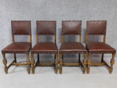 A set of four Jacobean style oak dining chairs on carved baluster stretchered supports. H.88cm